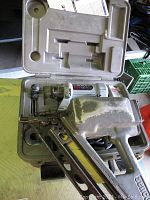 Open plastic carrying case with Rotozip spiral saw SCS01LE inside