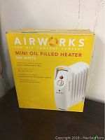 Photo of the Airworks Mini Oil Filled Heater box front showing the product name and wattage.