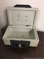 Open Sentry fire box showing interior and key in lock