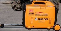 Side view of orange and black Kipor inverter generator showing model and wheel/handle kit