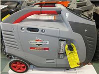 Left-side view showing Briggs & Stratton badge, model P3000 label, red handle and wheels, and warning tag