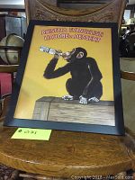 Full view of the framed print showing a chimpanzee drinking liquor with the text 'ANISETA EVANGELISTI LIQUORE DA DESSERT'.