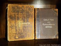 Spines and front covers of both volumes on shelf