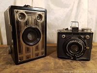 Front view of both Brownie cameras showing the Brownie Junior Six-16 on the left and the Brownie Flash Six-20 on the right
