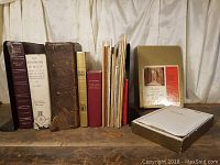 Overview of the collection showing 12 books and booklets including large Bibles, religious texts, and pamphlets.