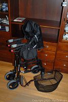 Nexus walker with padded handles and seat against wood furniture