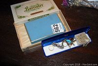 Overview of Barrister cigar box and blue jewelry box showing all items