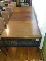 Full view of extended dining table with chairs