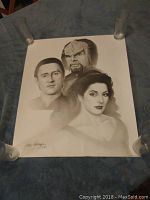 Signed 1993 Star Trek Next Generation black and white print featuring Data, Worf, and Deanna Troi on a white background lying flat.