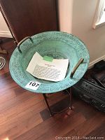 Bowl on stand showing patina and handles