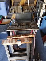 Photo of the table saw on the work stand with saw horses below, showing the full assembled setup and condition of each item.