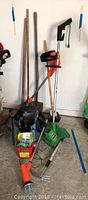 Shows the Gardenia and K&S trimmers along with shovel, garden fork, and other tools on floor.