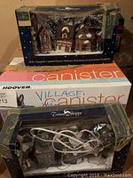 Photo of 12-piece porcelain lighted houses set in original Trim Shoppe box with some tape wear