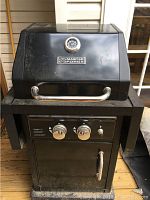 Front view of black Master Forge propane grill with lid closed, stainless steel handle and built-in thermometer on lid. Grill shows dirt and wear.