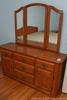 Full front view of the Shermag oak wood dresser with tri-fold mirror attached, showing drawers and cabinets.