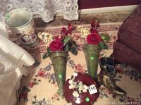 The full lot showing the pair of green hanging vases with artificial flowers, Victorian boot vase, metal bucket, and small wall hanging.