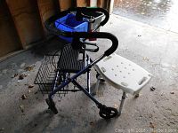 Invacare Stingray walker with black padded handles, foldable seat, and basket, shown with white plastic bath bench with aluminum legs.