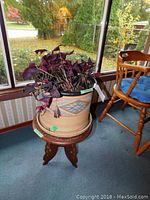Wooden round table with carved legs and polished brown finish, dimensiones approx 16x18 inches.