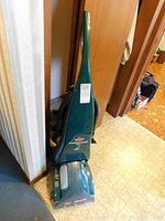 Full view of Bissell Powersteamer Pro standing upright showing front and handles.