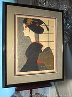 Full front view of framed woodblock print showing overall composition and frame