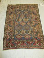 Full view of antique Caucasian Durbend rug showing overall geometric pattern and color scheme.