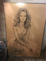 Full view of large framed portrait showing seated woman with curly hair, signed and dated 1971.