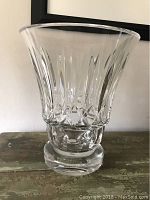 Front angled view of the Baccarat crystal vase showing the cut design, flared top and thick base.