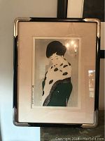 Full view of framed Asian hand colored picture depicting a woman with black hair and traditional attire.