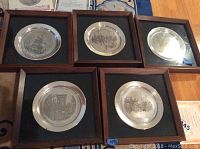 All five framed plates laid out on floor