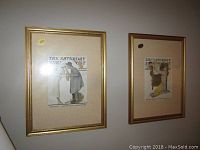 Two framed Saturday Evening Post covers side by side on wall, gold-tone frames with vintage magazine cover illustrations.