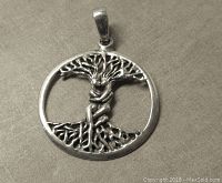 Front view showing detailed Tree of Life with female figure design within circular frame.