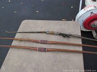 Three recurve bows laid flat showing full length, materials, and build