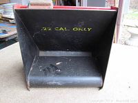 Photo showing inside of bullet trap with '.22 CAL. ONLY' text stamped in yellow.