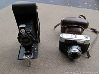 Kodak Model B 2A folding camera upright showing bellows and lens.