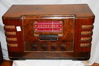 Front view of Westinghouse radio showing wood burled face, control knobs, and push buttons.