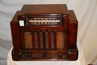 Front view of Addison radio showing wood cabinet, tuning dial and speaker grille