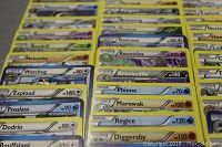 Close-up photo showing various Pokémon trading cards including Meloetta, Watchog, Exploud, Froslass, Dodrio, Bouffalant, Crookodile, Phione, Marowak, Regice, and Diggersby.