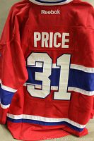 Back view of red Montreal Canadiens Carey Price jersey showing name and number 31 with Reebok branding