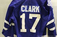 Back view of the blue maple leafs hockey jersey showing 'CLARK' name and number 17 in white stitched lettering.
