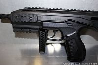 Close-up of black plastic grip and tactical foregrip with Umarex branding visible.