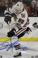 Full front view of the 8x10 signed photo showing Patrick Kane in game action and autograph across bottom.