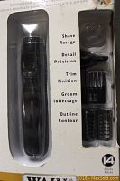 Front packaging view of sealed WAHL All In One rechargeable trimmer set with visible attachments and product details.