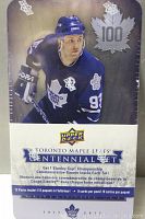 Front of sealed tin showing hockey player in Toronto Maple Leafs uniform and Upper Deck branding, indicating 12 packs inside and 8 cards per pack with Stanley Cup Championship commemorative banner included.