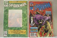 Comic with green cover celebrating Spider-Man's 30th Anniversary alongside The Sensational Spider-Man cover showing villain with purple cloak.