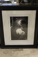 Full front view of framed black and white Boba Fett portrait showing the overall condition including frame and matting.