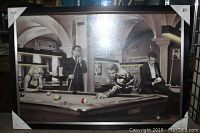 Full view of the framed and matted poster with four iconic vintage pop culture figures playing pool in a black and white photo style.