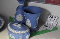 Photo showing small covered box and pair of small vases or jugs in blue and white jasperware style