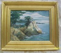 Framed watercolour painting of a coastal scene with a lone cypress on a cliffside with ocean and sky background, signed P. Akay.