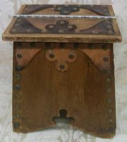 Close-up side view showing leather accents, rivets, and construction detail of the shoe shine box.