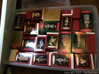Photo showing the plastic bin filled with boxed Hallmark Keepsake Ornaments